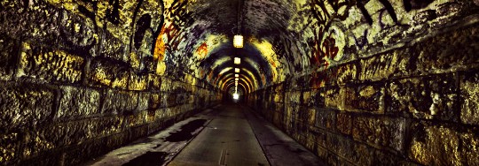 graffidi on walls of underground tunnel 1