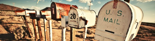 row of old rural mailboxes