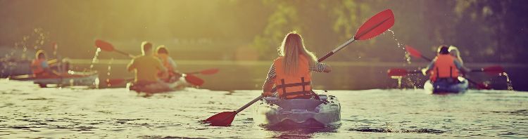 Kayaking and canoeing with family. Children on canoe. Family on kayak ride.