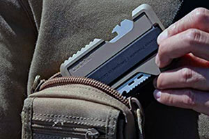 Best Tactical Wallet - Solider Putting Minimalist Tactical Wallet Into EDC Bag