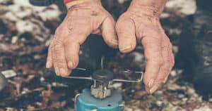 Old Man Heating His Hands